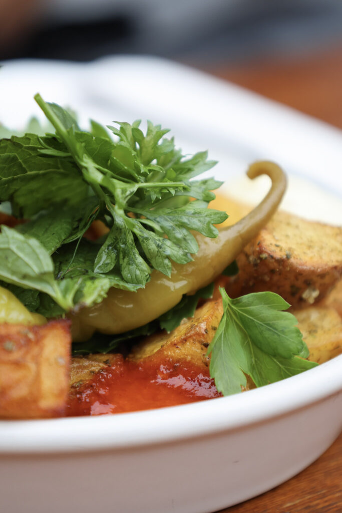 Fried courgette with peppers and fresh herbs